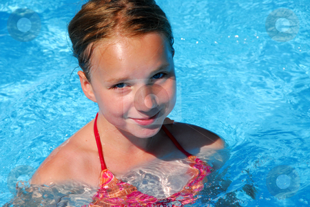 To use this stock image in your creative project, please select the size you need over to the right and click the "Add to Cart" button.
Your downloaded image will come with the Cutcaster watermark removed so don’t worry about the watermark you see on this page. Girl in a swimming pool stock photo, Young girl in a swimming pool by Elena Elisseeva