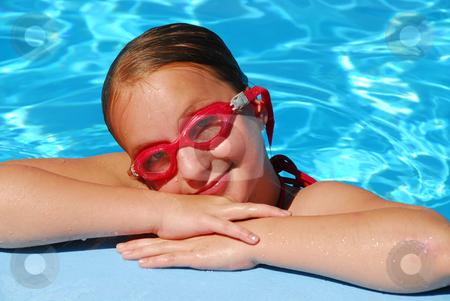 To use this stock image in your creative project, please select the size you need over to the right and click the "Add to Cart" button.
Your downloaded image will come with the Cutcaster watermark removed so don’t worry about the watermark you see on this page. Girl portrait pool stock photo, Portrait of a young girl in red goggles resting at the pool edge by Elena Elisseeva