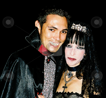 To use this stock image in your creative project, please select the size you need over to the right and click the "Add to Cart" button.
Your downloaded image will come with the Cutcaster watermark removed so don’t worry about the watermark you see on this page. Count and Countess stock photo, Bride and Groom dressed up as Count and Countess Vampires during Halloween wedding by Marburg