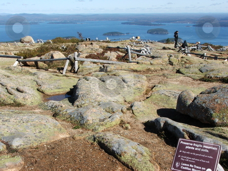 To use this stock image in your creative project, please select the size you need over to the right and click the "Add to Cart" button.
Your downloaded image will come with the Cutcaster watermark removed so don’t worry about the watermark you see on this page. Cadillac Mountain Summit stock photo, Cadillac Mountain on Mount Desert Isle in Acadia National Park near Bar Harbor, Maine is the tallest mountain (1,528) bordering the eastern seaboard and easily accessible by car for tourists. This vantage point is from the summit looking east toward the Atlantic. Breath taking views abound in this national park. by Dennis Thomsen