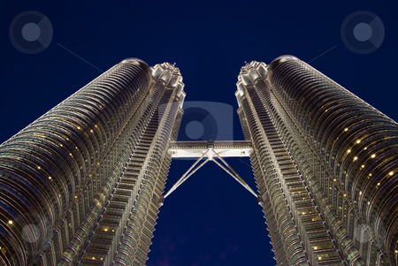 To use this stock image in your creative project, please select the size you need over to the right and click the "Add to Cart" button.
Your downloaded image will come with the Cutcaster watermark removed so don’t worry about the watermark you see on this page. Kuala Lumpur twin towers stock photo, The Kuala Lumpur twin towers at night by Stefan Breton