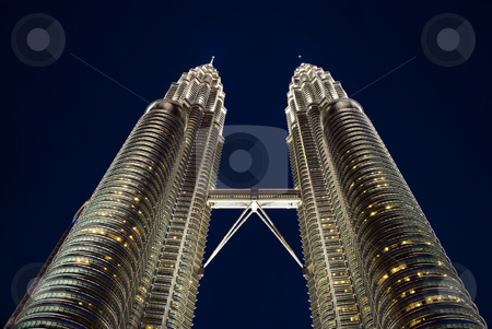 To use this stock image in your creative project, please select the size you need over to the right and click the "Add to Cart" button.
Your downloaded image will come with the Cutcaster watermark removed so don’t worry about the watermark you see on this page. Kuala Lumpur twin towers stock photo, The Kuala Lumpur twin towers at night by Stefan Breton