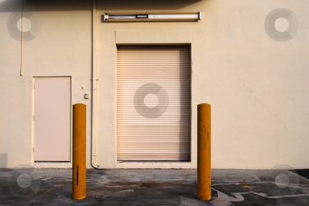 To use this stock image in your creative project, please select the size you need over to the right and click the "Add to Cart" button.
Your downloaded image will come with the Cutcaster watermark removed so don’t worry about the watermark you see on this page. Loading Door stock photo, Loading door at the rear of a small business by Robert Cabrera