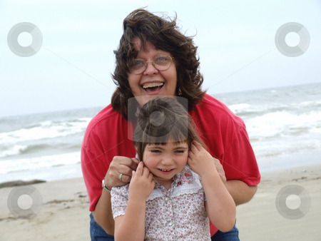 To use this stock image in your creative project, please select the size you need over to the right and click the "Add to Cart" button.
Your downloaded image will come with the Cutcaster watermark removed so don’t worry about the watermark you see on this page. Fun at the Beach stock photo, Adult woman and child playing at the beach by Marburg