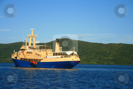 To use this stock image in your creative project, please select the size you need over to the right and click the "Add to Cart" button.
Your downloaded image will come with the Cutcaster watermark removed so don’t worry about the watermark you see on this page. Cruise ship stock photo, A small blue cruise ship on a sunny day by Jonas Marcos San Luis