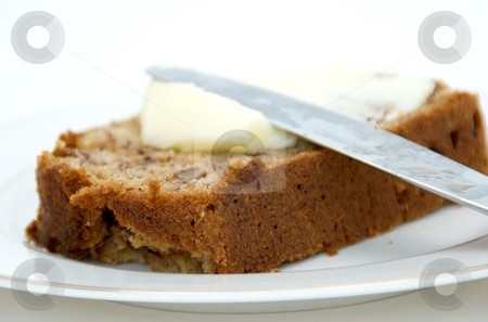 To use this stock image in your creative project, please select the size you need over to the right and click the "Add to Cart" button.
Your downloaded image will come with the Cutcaster watermark removed so don’t worry about the watermark you see on this page. Banana Bread stock photo, A slice of banana bread with butter. by Josh Lee