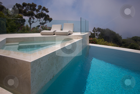 To use this stock image in your creative project, please select the size you need over to the right and click the "Add to Cart" button.
Your downloaded image will come with the Cutcaster watermark removed so don’t worry about the watermark you see on this page. Custom Luxury Pool, Hot Tub and Chairs Abstract stock photo, Custom Luxury Pool, Hot Tub and Chairs Abstract with Coastal Clouds in Background. by Andy Dean