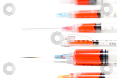 To use this stock image in your creative project, please select the size you need over to the right and click the "Add to Cart" button.
Your downloaded image will come with the Cutcaster watermark removed so don’t worry about the watermark you see on this page. Syringes stock photo, A set of colorful syringes with various medications. by Robert Byron