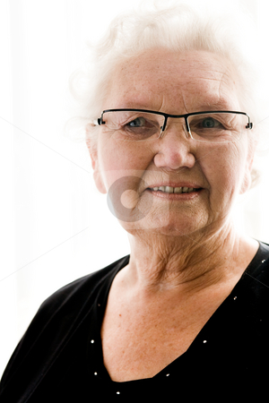 To use this stock image in your creative project, please select the size you need over to the right and click the "Add to Cart" button.
Your downloaded image will come with the Cutcaster watermark removed so don’t worry about the watermark you see on this page. Portrait of a grandmother stock photo, Portait of an elderly woman by Frenk and Danielle Kaufmann