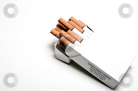 To use this stock image in your creative project, please select the size you need over to the right and click the "Add to Cart" button.
Your downloaded image will come with the Cutcaster watermark removed so don’t worry about the watermark you see on this page. Pack of Cigarettes stock photo, Cigarettes in a white box with the surgeon generals warning. by Robert Byron