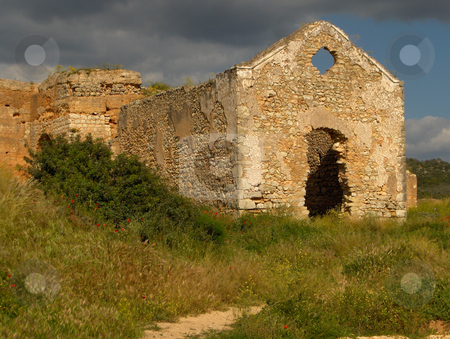 To use this stock image in your creative project, please select the size you need over to the right and click the "Add to Cart" button.
Your downloaded image will come with the Cutcaster watermark removed so don’t worry about the watermark you see on this page. Ruined Church stock photo, A crumbling church in a ruined castle in the Algarve region of Portugal. by Jessica Tooley