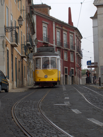 To use this stock image in your creative project, please select the size you need over to the right and click the "Add to Cart" button.
Your downloaded image will come with the Cutcaster watermark removed so don’t worry about the watermark you see on this page. Yellow Streetcar stock photo, An historic yellow tram in Lisbon, Portugal. by Jessica Tooley