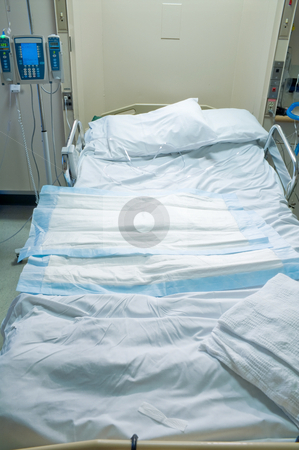 To use this stock image in your creative project, please select the size you need over to the right and click the "Add to Cart" button.
Your downloaded image will come with the Cutcaster watermark removed so don’t worry about the watermark you see on this page. Hospital Room stock photo, A medical patient's bed in a hospital. by Robert Byron