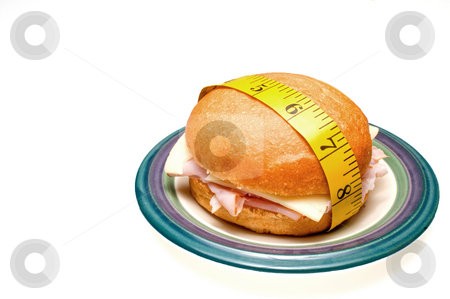 To use this stock image in your creative project, please select the size you need over to the right and click the "Add to Cart" button.
Your downloaded image will come with the Cutcaster watermark removed so don’t worry about the watermark you see on this page. Ham and Swiss Sandwich stock photo, A ham and swiss cheese sandwich wrapped in a taolor's measuring tape. by Robert Byron