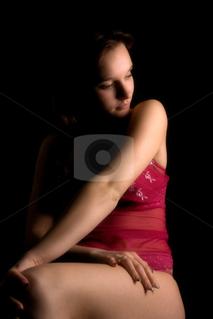 To use this stock image in your creative project, please select the size you need over to the right and click the "Add to Cart" button.
Your downloaded image will come with the Cutcaster watermark removed so don’t worry about the watermark you see on this page. Low key lingerie waiting stock photo, Studio portrait of a woman in luxurious lingerie in a low key setting by Frenk and Danielle Kaufmann