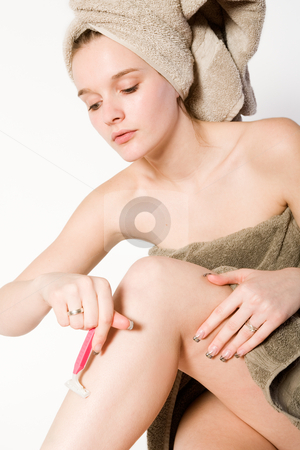 To use this stock image in your creative project, please select the size you need over to the right and click the "Add to Cart" button.
Your downloaded image will come with the Cutcaster watermark removed so don’t worry about the watermark you see on this page. Young girl is shaving her leg stock photo, Young woman in towel on a white background shaving by Frenk and Danielle Kaufmann