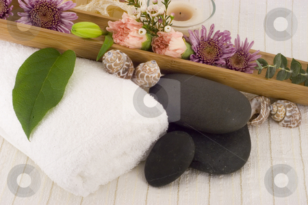 To use this stock image in your creative project, please select the size you need over to the right and click the "Add to Cart" button.
Your downloaded image will come with the Cutcaster watermark removed so don’t worry about the watermark you see on this page. Massage stones stock photo, Massage Stones, Flowers, and Towel 2 by Ariana Bauer