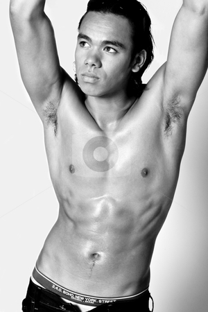 To use this stock image in your creative project, please select the size you need over to the right and click the "Add to Cart" button.
Your downloaded image will come with the Cutcaster watermark removed so don’t worry about the watermark you see on this page. Asian sexy looking boy showing his sixpack stock photo, Studio portrait of a muscular Asian sexy looking boy showing of his six pack by Frenk and Danielle Kaufmann