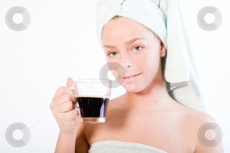 To use this stock image in your creative project, please select the size you need over to the right and click the "Add to Cart" button.
Your downloaded image will come with the Cutcaster watermark removed so don’t worry about the watermark you see on this page. Wellness girl series coffee cup stock photo, Studio portrait of a spa girl drinking coffee and making eye contact by Frenk and Danielle Kaufmann