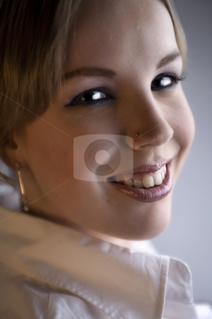 To use this stock image in your creative project, please select the size you need over to the right and click the "Add to Cart" button.
Your downloaded image will come with the Cutcaster watermark removed so don’t worry about the watermark you see on this page. Portrait of an attractive blond curly woman stock photo, Studio portrait of a young blond curly woman looking attractive by Frenk and Danielle Kaufmann