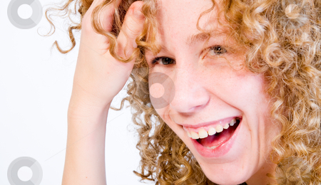 To use this stock image in your creative project, please select the size you need over to the right and click the "Add to Cart" button.
Your downloaded image will come with the Cutcaster watermark removed so don’t worry about the watermark you see on this page. Red hair curls and a big smile stock photo, A girl who is having fun in the photo studio by Frenk and Danielle Kaufmann