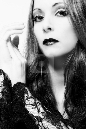 To use this stock image in your creative project, please select the size you need over to the right and click the "Add to Cart" button.
Your downloaded image will come with the Cutcaster watermark removed so don’t worry about the watermark you see on this page. Curious gothic stock photo, Portrait of a woman in front of a white background in a studio enviroment by Frenk and Danielle Kaufmann
