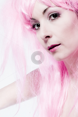 To use this stock image in your creative project, please select the size you need over to the right and click the "Add to Cart" button.
Your downloaded image will come with the Cutcaster watermark removed so don’t worry about the watermark you see on this page. Pink wig stock photo, Portrait of a woman in front of a white background in a studio enviroment by Frenk and Danielle Kaufmann