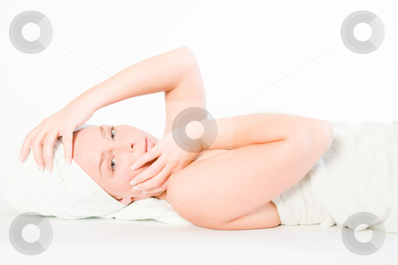To use this stock image in your creative project, please select the size you need over to the right and click the "Add to Cart" button.
Your downloaded image will come with the Cutcaster watermark removed so don’t worry about the watermark you see on this page. Wellness girl series laying down and feeling stock photo, Studio portrait of a spa girl fondling her head by Frenk and Danielle Kaufmann