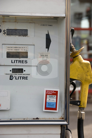 To use this stock image in your creative project, please select the size you need over to the right and click the "Add to Cart" button.
Your downloaded image will come with the Cutcaster watermark removed so don’t worry about the watermark you see on this page. Gas Pump stock photo, An old gas pump with French and English labels by Maria Bell