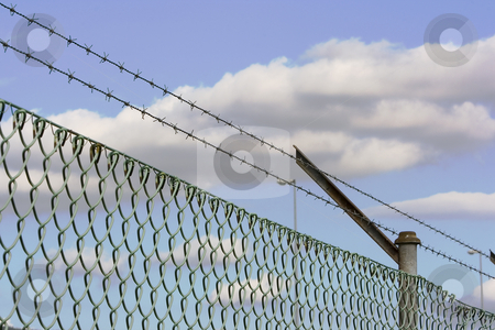 To use this stock image in your creative project, please select the size you need over to the right and click the "Add to Cart" button.
Your downloaded image will come with the Cutcaster watermark removed so don’t worry about the watermark you see on this page. Fence stock photo, Barbed wire fence as a security system by Ivan Montero