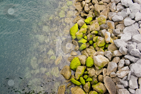 To use this stock image in your creative project, please select the size you need over to the right and click the "Add to Cart" button.
Your downloaded image will come with the Cutcaster watermark removed so don’t worry about the watermark you see on this page. Water stock photo, The water of the sea and some rocks in the shore by Ivan Montero