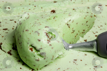 To use this stock image in your creative project, please select the size you need over to the right and click the "Add to Cart" button.
Your downloaded image will come with the Cutcaster watermark removed so don’t worry about the watermark you see on this page. Mint Chocolate Chip Ice Cream stock photo, A big scoop of mint chocolate chip ice cream. by Robert Byron