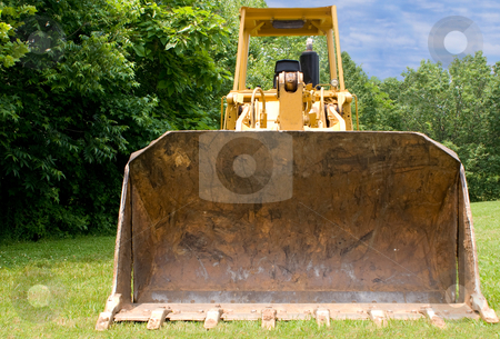 To use this stock image in your creative project, please select the size you need over to the right and click the "Add to Cart" button.
Your downloaded image will come with the Cutcaster watermark removed so don’t worry about the watermark you see on this page. Bulldozer stock photo, A large construction bulldozer ready for work. by Robert Byron