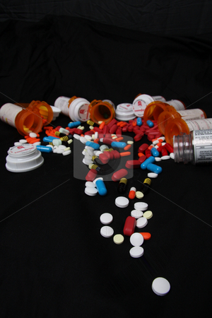 To use this stock image in your creative project, please select the size you need over to the right and click the "Add to Cart" button.
Your downloaded image will come with the Cutcaster watermark removed so don’t worry about the watermark you see on this page. Pharmaceuticals stock photo, Drugs, prescriptions medicines, pills, and bottles pouring out onto black background by JESSICA FELICIANA