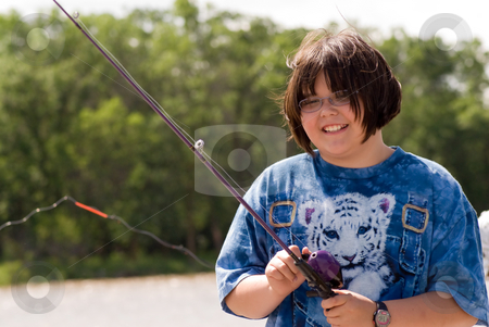 To use this stock image in your creative project, please select the size you need over to the right and click the "Add to Cart" button.
Your downloaded image will come with the Cutcaster watermark removed so don’t worry about the watermark you see on this page. Child Fishing stock photo, A young girl fishing on a warm summer day by Richard Nelson