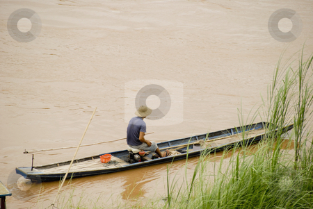 To use this stock image in your creative project, please select the size you need over to the right and click the "Add to Cart" button.
Your downloaded image will come with the Cutcaster watermark removed so don’t worry about the watermark you see on this page. Man in boat stock photo, Man in boat in Luang Prabang with copyspace by Claudia Van Dijk