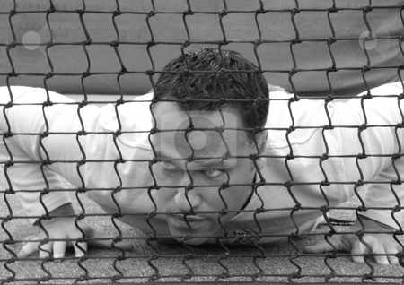 To use this stock image in your creative project, please select the size you need over to the right and click the "Add to Cart" button.
Your downloaded image will come with the Cutcaster watermark removed so don’t worry about the watermark you see on this page. Man lying behind net stock photo, Man Lying on the ground behind a tennis net by Claudia Van Dijk