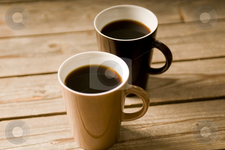To use this stock image in your creative project, please select the size you need over to the right and click the "Add to Cart" button.
Your downloaded image will come with the Cutcaster watermark removed so don’t worry about the watermark you see on this page. Two Cups of coffee with shallow DOF stock photo, Two Cups of coffee on a wooden table, with shallow DOF by Claudia Van Dijk