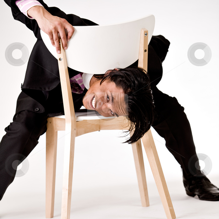 To use this stock image in your creative project, please select the size you need over to the right and click the "Add to Cart" button.
Your downloaded image will come with the Cutcaster watermark removed so don’t worry about the watermark you see on this page. Young man is acting like an idiot stock photo, Young indonesian man in a business suit by Frenk and Danielle Kaufmann