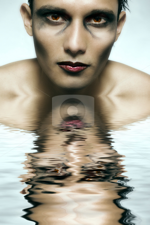 To use this stock image in your creative project, please select the size you need over to the right and click the "Add to Cart" button.
Your downloaded image will come with the Cutcaster watermark removed so don’t worry about the watermark you see on this page. Indonesian young man made scary stock photo, Studio portrait of mixed race young man with extreme make-up by Frenk and Danielle Kaufmann