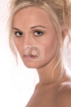 To use this stock image in your creative project, please select the size you need over to the right and click the "Add to Cart" button.
Your downloaded image will come with the Cutcaster watermark removed so don’t worry about the watermark you see on this page. Small blond looking stock photo, Portrait of a beautiful blond in the studio making eye contact by Frenk and Danielle Kaufmann