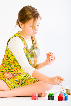 To use this stock image in your creative project, please select the size you need over to the right and click the "Add to Cart" button.
Your downloaded image will come with the Cutcaster watermark removed so don’t worry about the watermark you see on this page. Girl painting easter eggs stock photo, Studio portrait of a young blond girl painting eggs for easter by Frenk and Danielle Kaufmann