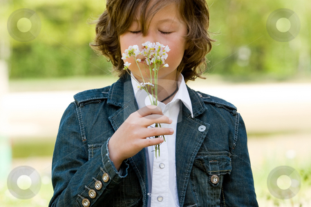 To use this stock image in your creative project, please select the size you need over to the right and click the "Add to Cart" button.
Your downloaded image will come with the Cutcaster watermark removed so don’t worry about the watermark you see on this page. Smelling it stock photo, Young boy is smelling on his flower by Frenk and Danielle Kaufmann