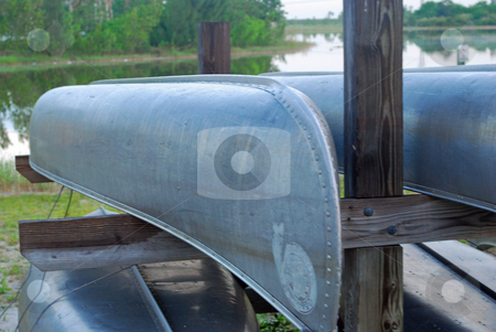 To use this stock image in your creative project, please select the size you need over to the right and click the "Add to Cart" button.
Your downloaded image will come with the Cutcaster watermark removed so don’t worry about the watermark you see on this page. Canoes stock photo, Conoes stacked in a rack at a lake by Robert Cabrera