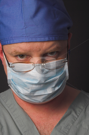 To use this stock image in your creative project, please select the size you need over to the right and click the "Add to Cart" button.
Your downloaded image will come with the Cutcaster watermark removed so don’t worry about the watermark you see on this page. Surgeon stock photo, A medical doctor dressed in scrubs performing surgery. by Robert Byron