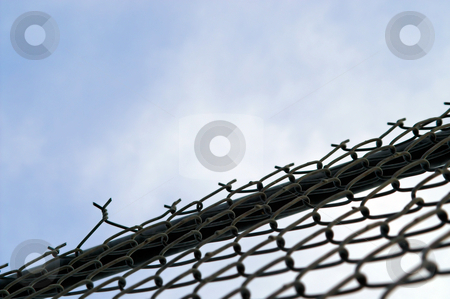To use this stock image in your creative project, please select the size you need over to the right and click the "Add to Cart" button.
Your downloaded image will come with the Cutcaster watermark removed so don’t worry about the watermark you see on this page. Chain Link Fence stock photo, A chain link fence for keeping people out or keeping people in. by Robert Byron