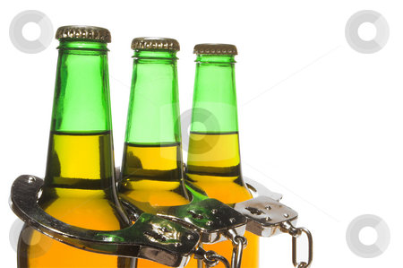 To use this stock image in your creative project, please select the size you need over to the right and click the "Add to Cart" button.
Your downloaded image will come with the Cutcaster watermark removed so don’t worry about the watermark you see on this page. Beer and Handcuffs - Drunk Driving Concept stock photo, Drunk driving concept - bottled beer and handcuffs. by Robert Byron
