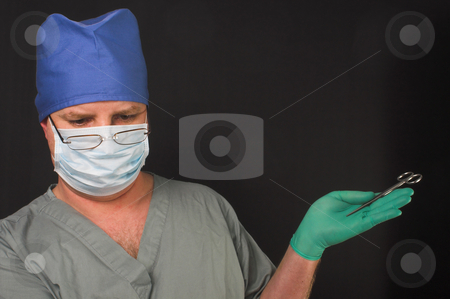 To use this stock image in your creative project, please select the size you need over to the right and click the "Add to Cart" button.
Your downloaded image will come with the Cutcaster watermark removed so don’t worry about the watermark you see on this page. Surgeon stock photo, A medical doctor dressed in scrubs performing surgery. by Robert Byron