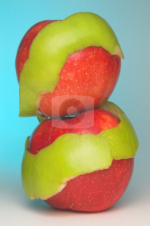 To use this stock image in your creative project, please select the size you need over to the right and click the "Add to Cart" button.
Your downloaded image will come with the Cutcaster watermark removed so don’t worry about the watermark you see on this page. Fresh Apples stock photo, Two red apples wrapped in a Granny Smith apple peel. by Robert Byron