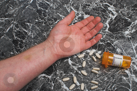 To use this stock image in your creative project, please select the size you need over to the right and click the "Add to Cart" button.
Your downloaded image will come with the Cutcaster watermark removed so don’t worry about the watermark you see on this page. Overdose stock photo, A person has overdosed on prescription medication. by Robert Byron